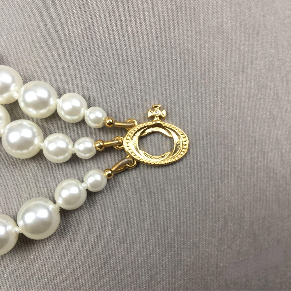 Vivienne Westwood Ivory Pearl Triple-Strand Choker Necklace with Gold Orb - Picture 5 of 7